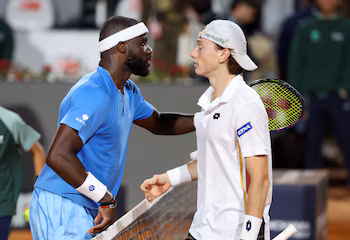 Frances Tiafoe of the USA and Ignacio Buse of Peru after their round of 64 match. REUTERS/Ciro De Luca